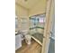 A bathroom features a shower stall with glass doors and shelves for storage at 345 S Forest St, Denver, CO 80246
