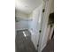 A walk-in closet features neutral colored walls, carpet, and a shelf for storage at 345 S Forest St, Denver, CO 80246