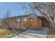 Charming single-story brick home with a covered carport and mature trees at 345 S Forest St, Denver, CO 80246