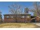 Charming brick home with mature trees and covered carport at 345 S Forest St, Denver, CO 80246