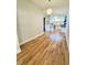 Hardwood floors and modern lighting fixture in an open-concept living space at 345 S Forest St, Denver, CO 80246