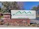 Community sign for Pinnacle at Highline with address against a brick base at 1671 W Canal Cir # 221, Littleton, CO 80120