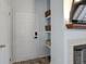 Welcoming entryway with storage shelves offers a practical and stylish first impression of the home at 1671 W Canal Cir # 221, Littleton, CO 80120
