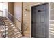 Close-up of a secure front door with a digital lock system and covered entry at 1671 W Canal Cir # 221, Littleton, CO 80120