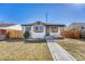 Charming home featuring a well-maintained front yard and a welcoming exterior at 1328 Holly St, Denver, CO 80220