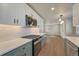 Updated kitchen with modern appliances, stylish backsplash, and bright lighting at 1328 Holly St, Denver, CO 80220