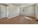 Spacious living room features modern flooring and a neutral color palette at 1328 Holly St, Denver, CO 80220
