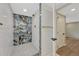 Luxurious walk-in shower with custom tile work and upscale fixtures, designed for relaxation at 1328 Holly St, Denver, CO 80220