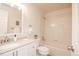 Bright bathroom showcasing a vanity with storage and a shower-over-tub combo at 12555 Birch Ave, Thornton, CO 80241