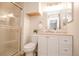 Clean bathroom features a white vanity, modern fixtures, and walk in shower at 12555 Birch Ave, Thornton, CO 80241