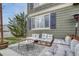 Backyard patio featuring gray cushioned pallet seating, an area rug, and green siding at 1192 S Fultondale Cir, Aurora, CO 80018