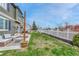 Spacious backyard with an outdoor seating area and lush lawn, perfect for outdoor gatherings at 1192 S Fultondale Cir, Aurora, CO 80018