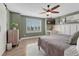 A cozy bedroom complete with stylish window shutters and a ceiling fan at 1192 S Fultondale Cir, Aurora, CO 80018