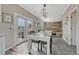 Eat-in kitchen dining area with backyard access and a view of the living room at 1192 S Fultondale Cir, Aurora, CO 80018