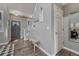 Inviting entryway featuring hardwood floors, coat hooks, a bench, and a gray front door at 1192 S Fultondale Cir, Aurora, CO 80018