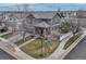 Charming two-story home featuring a well-maintained lawn and a two car garage at 1192 S Fultondale Cir, Aurora, CO 80018