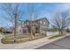 Charming two-story home with a stone facade, a two-car garage, and a covered front porch at 1192 S Fultondale Cir, Aurora, CO 80018
