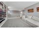 Spacious living room with built-in bookshelves and a comfortable seating area at 1192 S Fultondale Cir, Aurora, CO 80018