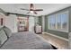 This is a stylish primary bedroom with a barn door leading to the en-suite bathroom at 1192 S Fultondale Cir, Aurora, CO 80018