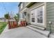Outdoor patio featuring a cushioned seating area, a heater, and glass-paneled doors at 1192 S Fultondale Cir, Aurora, CO 80018