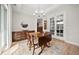 Dining room featuring a chandelier, and access to the outdoor patio through glass doors at 331 Josef Cir, Fort Lupton, CO 80621