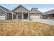 Charming home with a two-car garage, covered porch, and inviting curb appeal at 331 Josef Cir, Fort Lupton, CO 80621