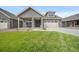 Charming home with a well-manicured lawn, a covered porch and an attached two car garage at 331 Josef Cir, Fort Lupton, CO 80621