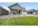 Charming home with a well-manicured lawn, a covered porch and an attached two car garage at 331 Josef Cir, Fort Lupton, CO 80621