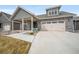 Charming home with a two-car garage, covered porch, and inviting curb appeal at 331 Josef Cir, Fort Lupton, CO 80621