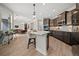 Kitchen with island, quartz countertops, stainless appliances, and pendant lighting at 331 Josef Cir, Fort Lupton, CO 80621