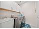 Convenient laundry room with washer, dryer, sink, and overhead cabinets at 331 Josef Cir, Fort Lupton, CO 80621