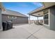 Outdoor patio with covered seating area and a grill for entertaining at 331 Josef Cir, Fort Lupton, CO 80621