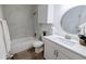 Well-lit bathroom with modern fixtures, updated vanity, and a tiled shower-tub combo at 13854 E Lehigh Ave # D, Aurora, CO 80014
