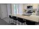 Open kitchen featuring counter seating and stainless steel appliances at 13854 E Lehigh Ave # D, Aurora, CO 80014