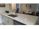 Updated kitchen with quartz counters and stainless steel appliances at 13854 E Lehigh Ave # D, Aurora, CO 80014