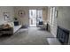 Bright living room with fireplace and large windows at 13854 E Lehigh Ave # D, Aurora, CO 80014