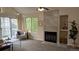 Spacious living room with fireplace and natural light at 13854 E Lehigh Ave # D, Aurora, CO 80014