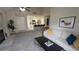 Open floorplan with view of kitchen, dining and living room with fireplace at 13854 E Lehigh Ave # D, Aurora, CO 80014
