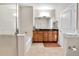 Double vanity bathroom with a large mirror and a walk-in shower at 13598 Via Varra # 301, Broomfield, CO 80020