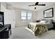 Sunlit bedroom featuring carpet floors, double windows, ceiling fan and a decorative wall mirror at 13598 Via Varra # 301, Broomfield, CO 80020