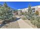 Attractive building exterior with landscaping and walkway at 13598 Via Varra # 301, Broomfield, CO 80020