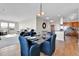 Open concept dining area with hardwood floors at 13598 Via Varra # 301, Broomfield, CO 80020