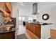 Modern kitchen featuring stainless steel appliances, granite countertops, and a functional island at 13598 Via Varra # 301, Broomfield, CO 80020