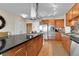 Modern kitchen featuring stainless steel appliances, granite countertops, and a functional island at 13598 Via Varra # 301, Broomfield, CO 80020