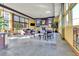Community lounge area with a fireplace, ample seating, and natural light at 13598 Via Varra # 301, Broomfield, CO 80020