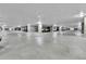 A parking garage features ample parking, bright lighting, and secure access at 13598 Via Varra # 301, Broomfield, CO 80020
