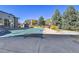 Community Pool with mature trees, a stone fireplace, and a mountain view at 13598 Via Varra # 301, Broomfield, CO 80020