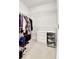 Bright walk-in closet with custom shelving and built-in storage, perfect for organizing clothes and accessories at 13598 Via Varra # 301, Broomfield, CO 80020