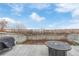 Spacious backyard patio perfect for outdoor dining and relaxing, featuring lake view at 649 Mockingbird St, Brighton, CO 80601
