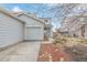 Charming home features a one-car garage, well-maintained front yard with shrubs, and a welcoming entrance at 649 Mockingbird St, Brighton, CO 80601